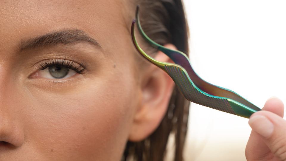 Close-up of an eye with full, natural-looking eyelash extensions on the upper lash line