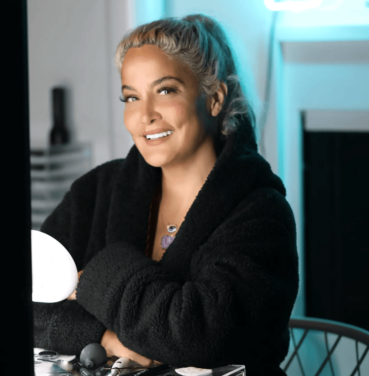 Lashify founder Sahara Lotti at her home workspace with Lashify lash products