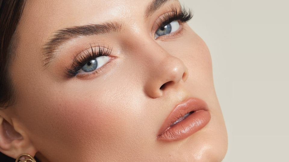 Model wearing Lashify Starburst Gossamer lashes for a multi-layered 60s lash look