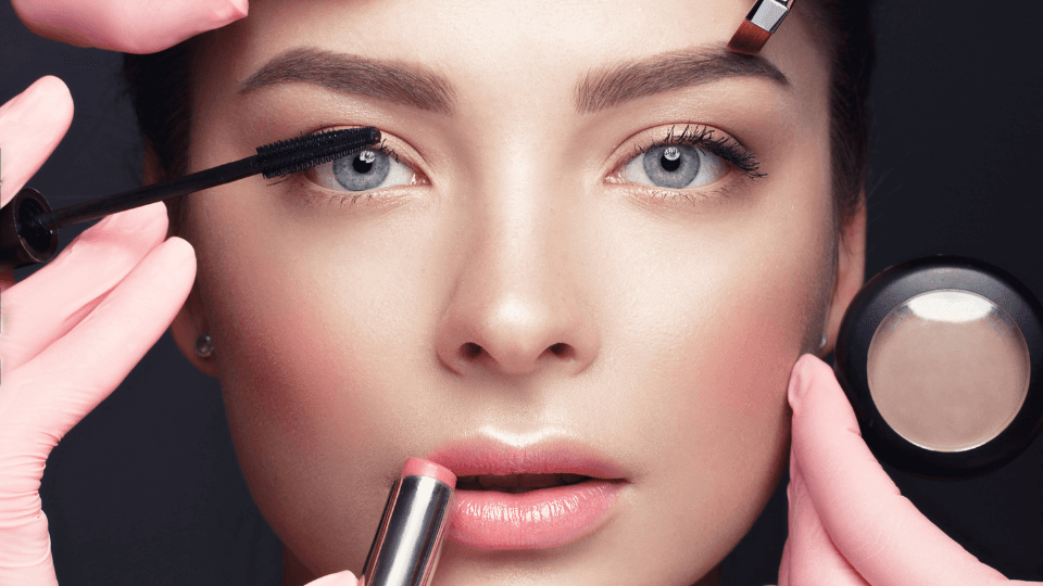Makeup brushes, sponges and tools laid out for professional makeup application