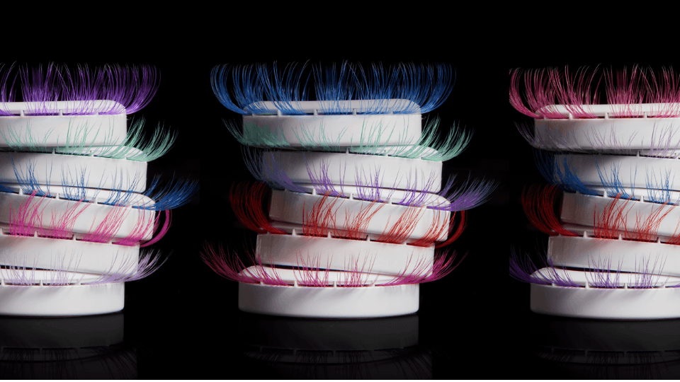 Model wearing rainbow Prismatic Gossamer colored lash extensions from Lashify