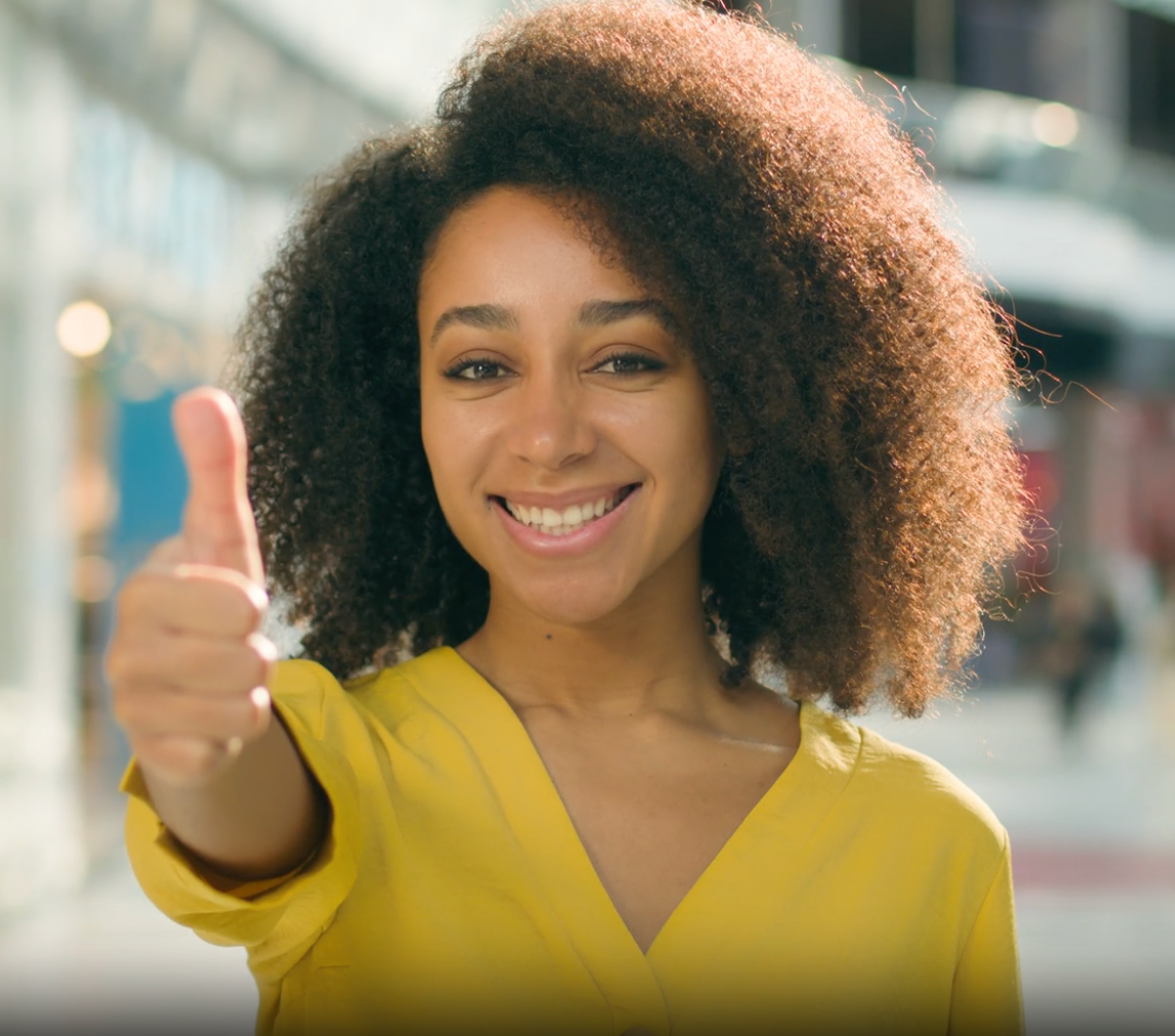 Lashify affiliate giving a confident thumbs-up, ready to grow her beauty business.